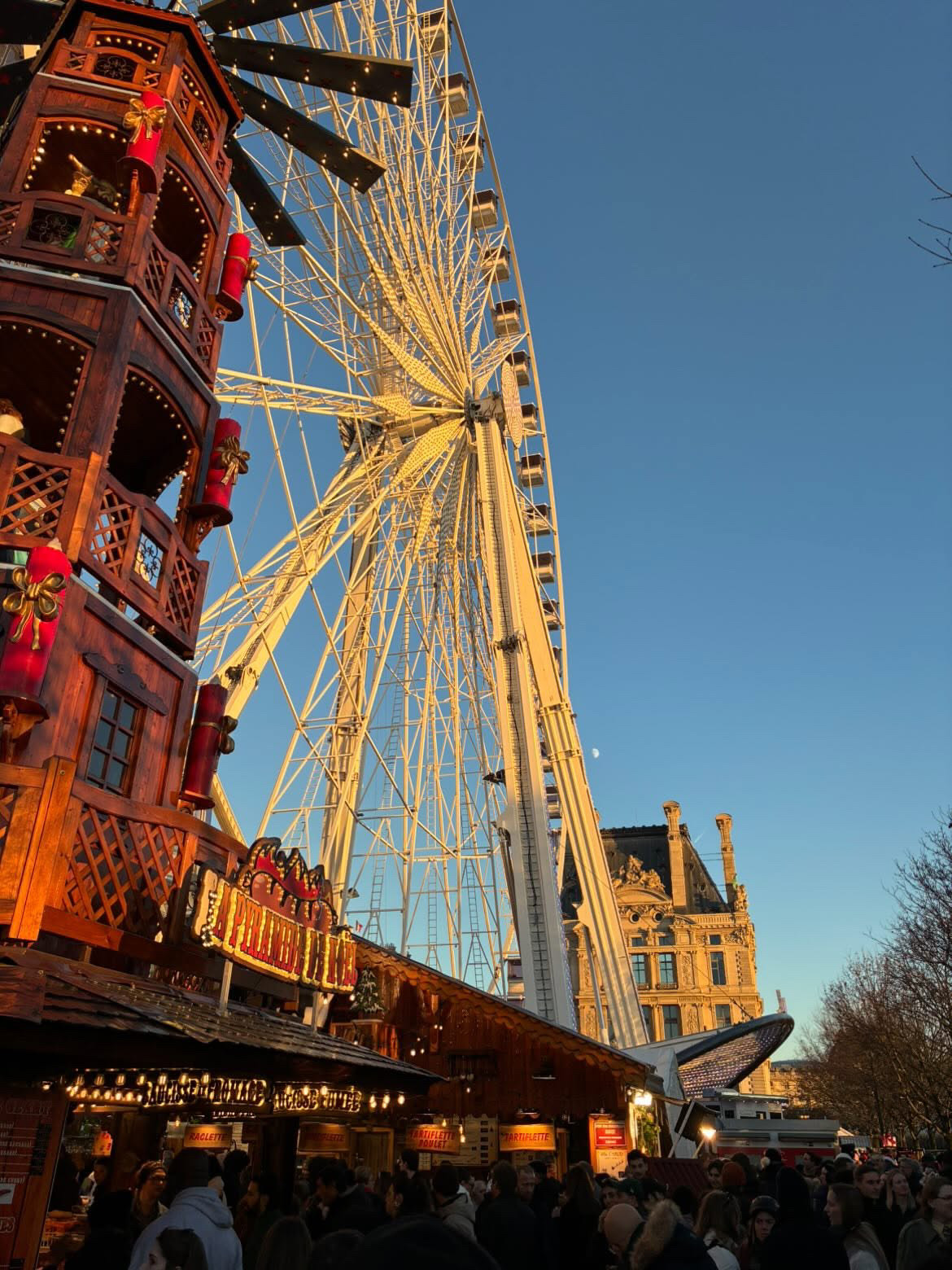 Ferris wheel at a Christmas market in Paris, France